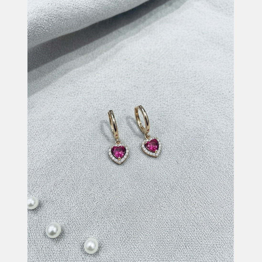 Gold Pink Cubic Zirconia Encased Heart Huggie Earrings by Lovisa